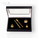 Set of gold crowns and scepter in a 'Crowns & Regalia' box on a white background